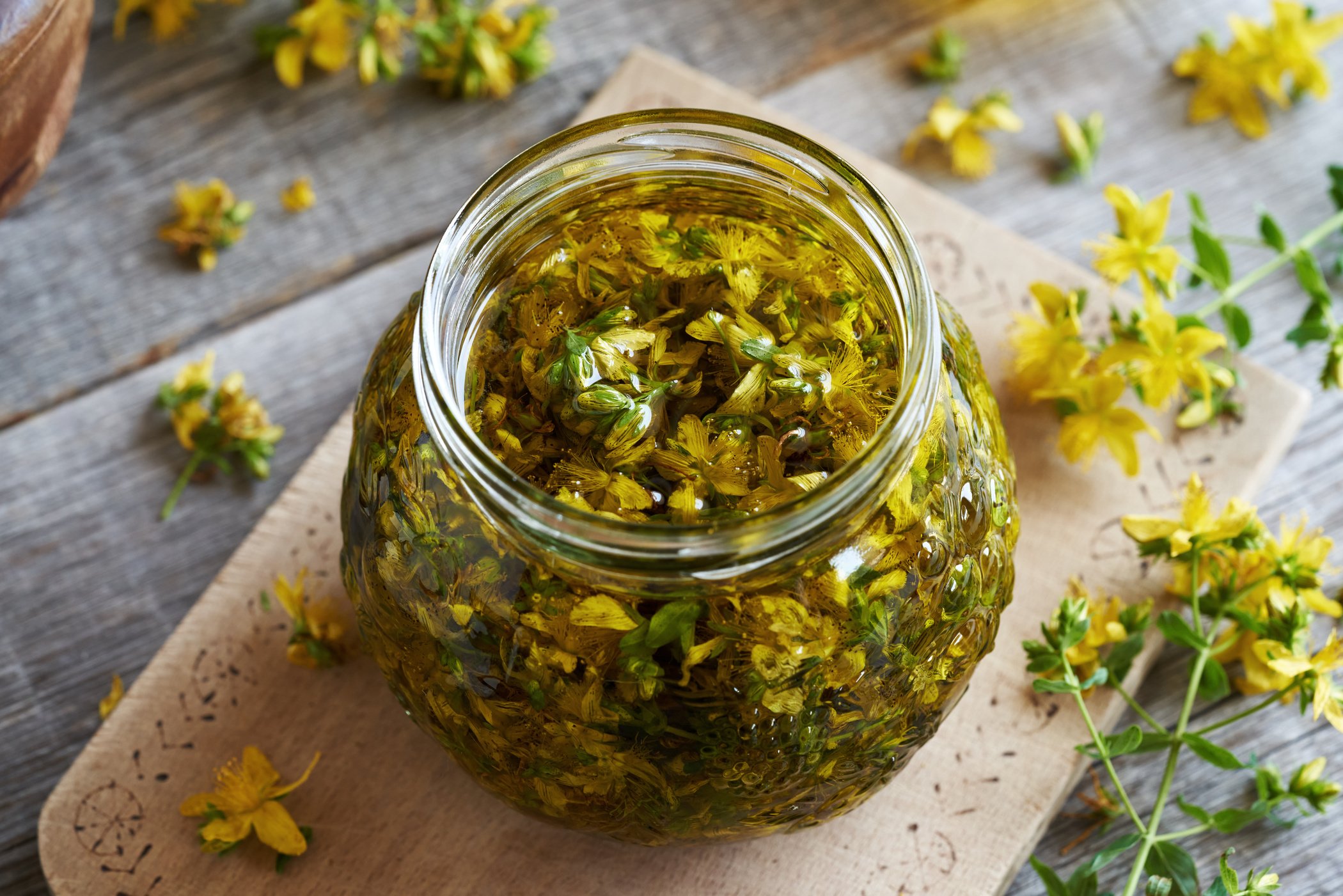 Jar with Fresh Saint John's Wort Flowers Macerating in Oil